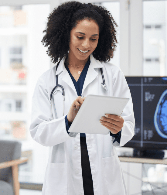 doctor talking with old woman in her house